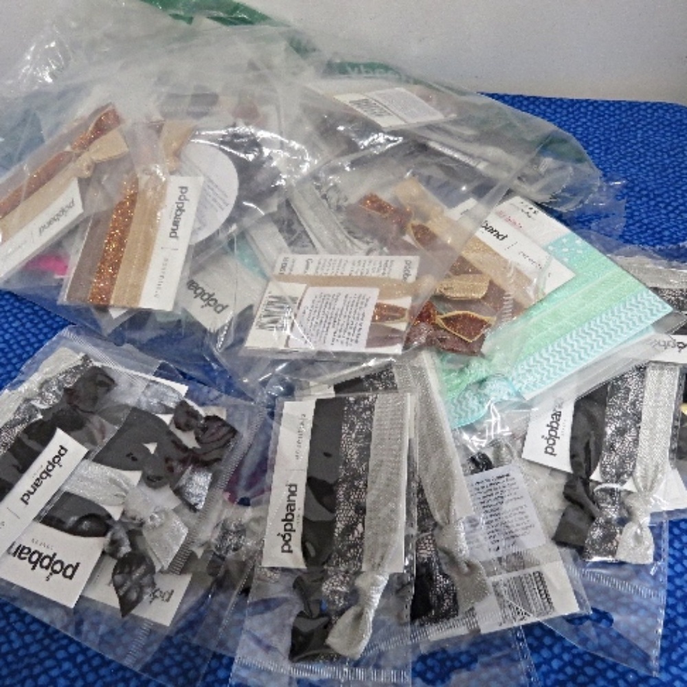 Approx. 40 New Packages of Popbands for your Hair Over 100 bands